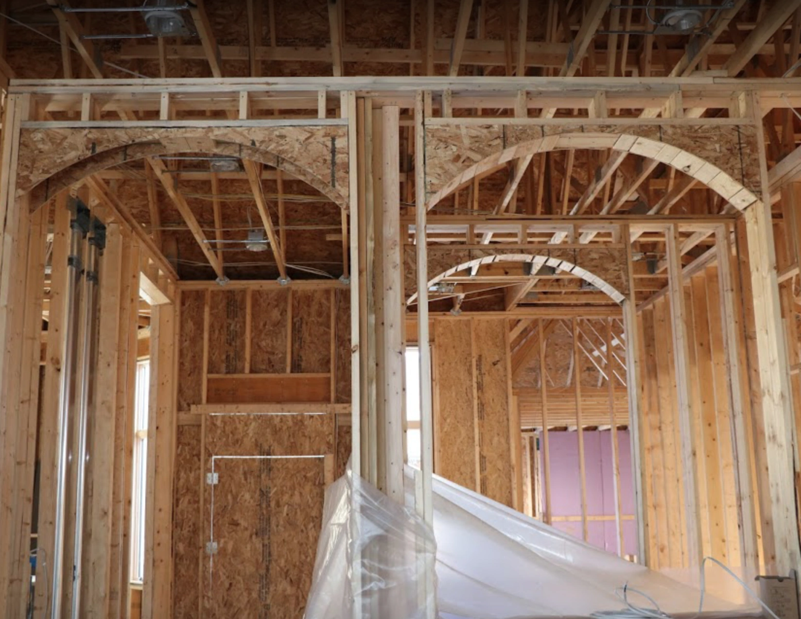 Custom arched framing during construction of the KPS Fulham home in Roseville