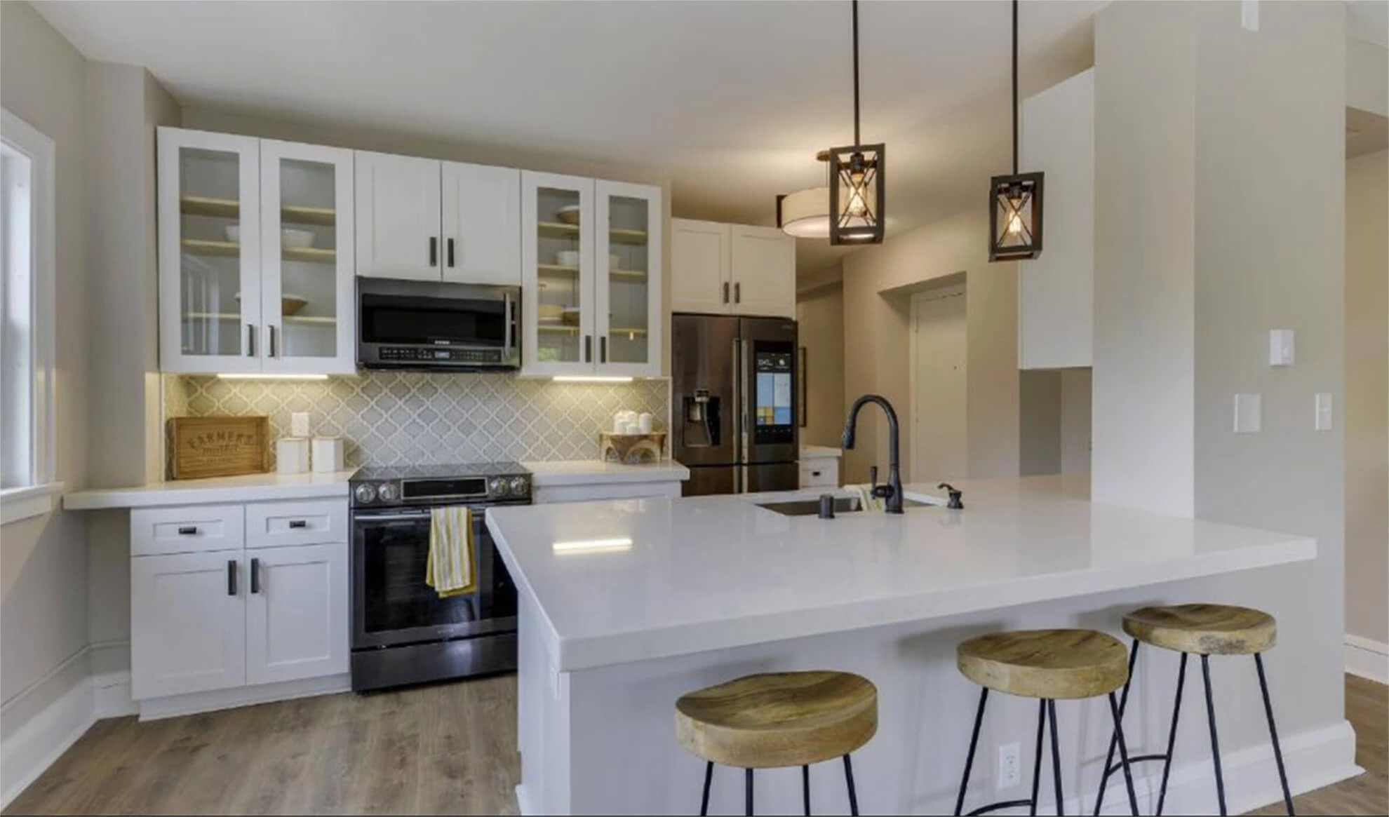 New cabinetry, island and finishes in the renovated 79 Western kitchen