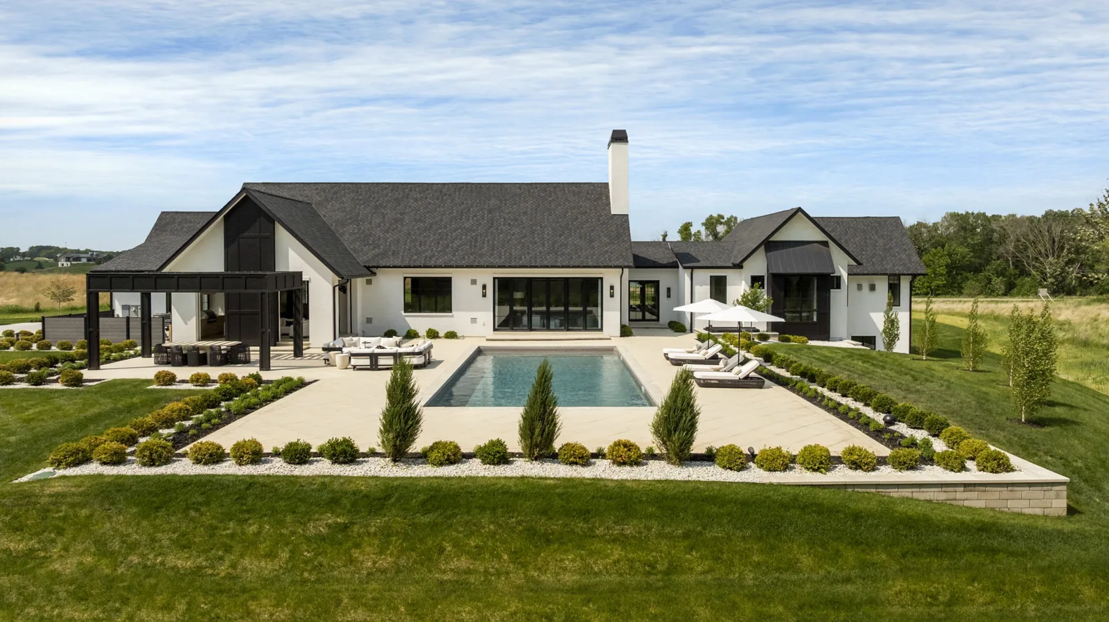 Rear elevation facing the pool and formally arranged gardens